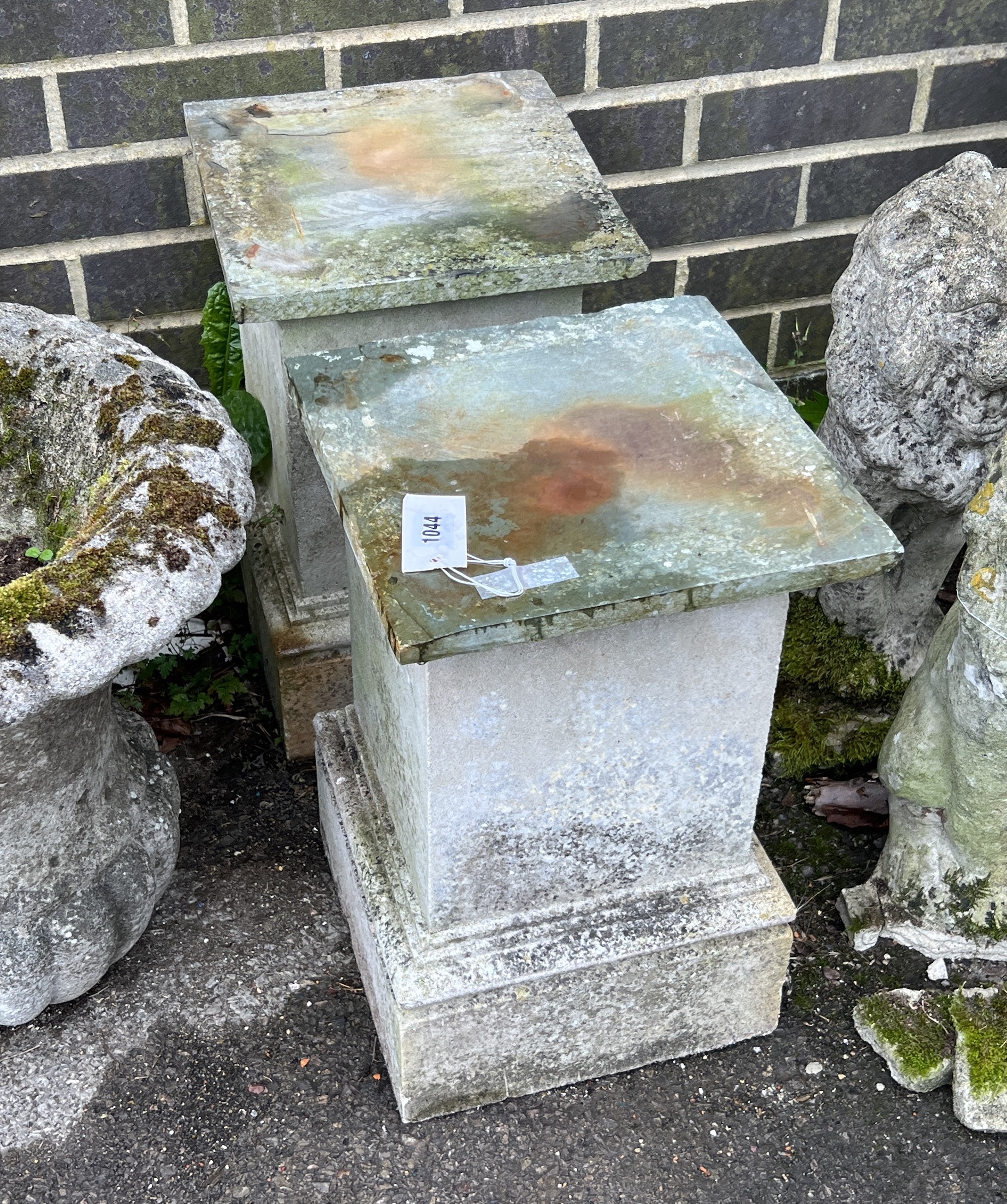A pair of reconstituted stone and slate square garden plinths, width 29cm, height 46cm